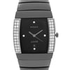 An image of a pre-owned wristwatch, viewed from the front in a close-up shot. The watch face is rectangular with a black background, adorned with diamond accents along the sides. The brand name is visible on the face, and it features silver hour and minute hands. The watch has a polished metallic band.