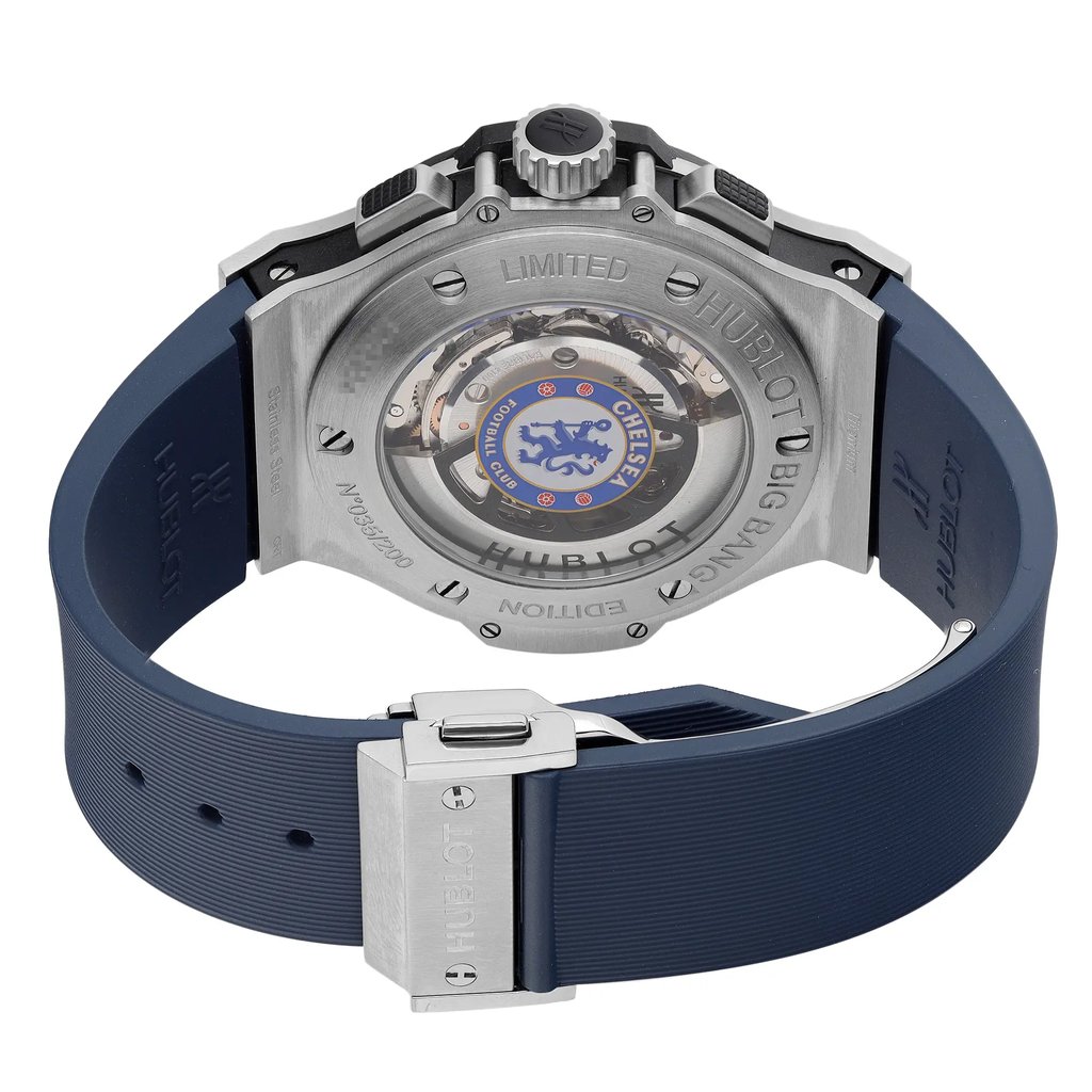 An image of a pre-owned wristwatch captured from the back view, showcasing the open case back and clasp. The watch features a visible mechanical movement with a logo at the center. The angle highlights the stainless steel back and the blue rubber strap, with the clasp being prominently displayed in the foreground. The image is taken at a close distance, providing a detailed look at the intricate details and engravings on the watch.