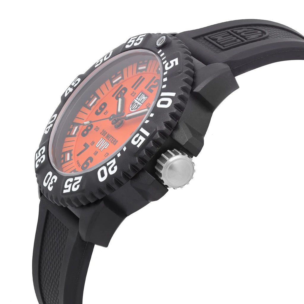 An image of a Wristwatch by Luminox. This Pre Owned item is designed for Men, featuring a Casual,Military style. It has a Quartz movement and an Analog display with a Orange dial color. The indices include 12-Hour Dial,Arabic Numerals,Easy to Read/Large Numerals. The band is made of Rubber and the case is made of Carbon. The watch has a Round shape with a case size of 44 mm and a case thickness of 13 mm.
