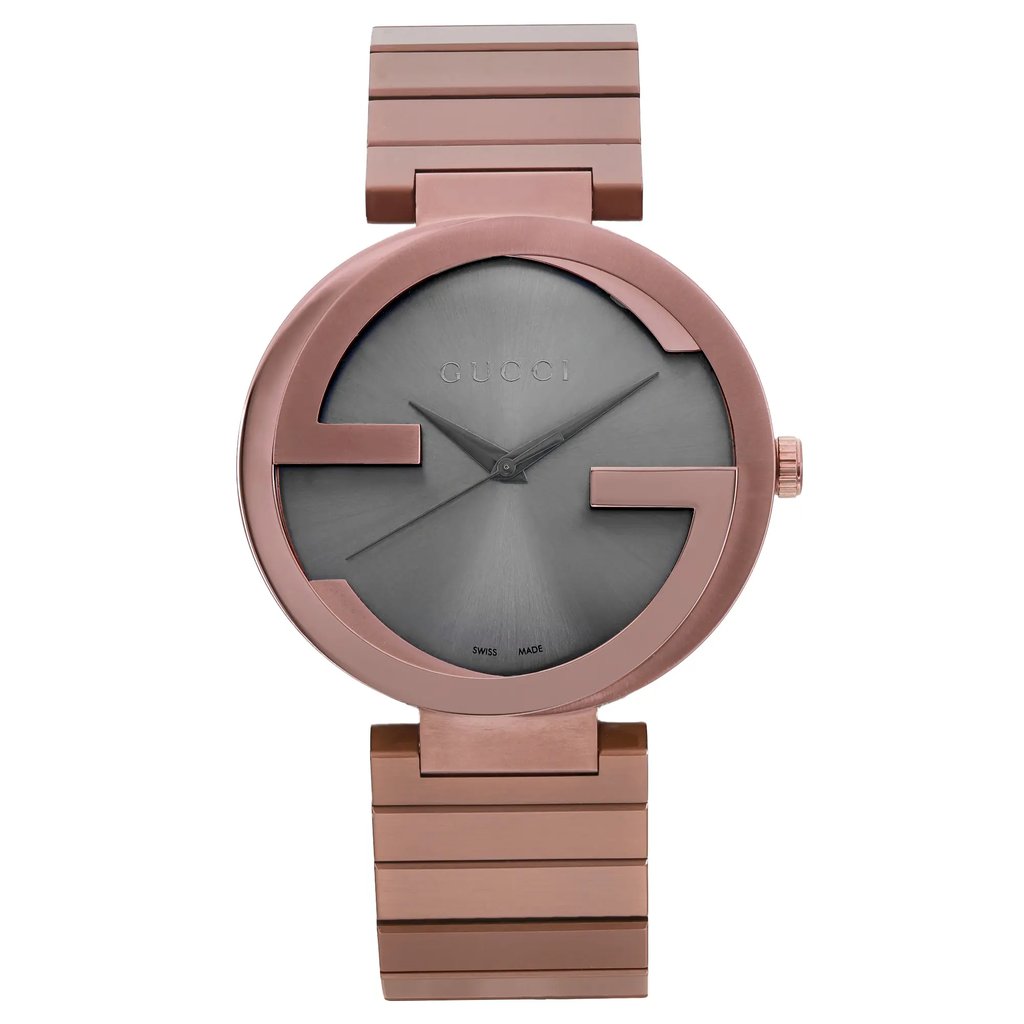 An image of a men's Gucci wristwatch in excellent condition, displayed in a full frontal view. The watch has a casual style with a round stainless steel case and band, both featuring a brown color. The brown dial shows the Gucci logo prominently with no hour marks and 12-hour dial indices. The bezel is also brown, matching the overall color scheme of the watch. The timepiece is positioned centrally against a neutral background and shown from a close distance, offering a clear and detailed view of its design and features. The watch may contain minor blemishes due to storing.