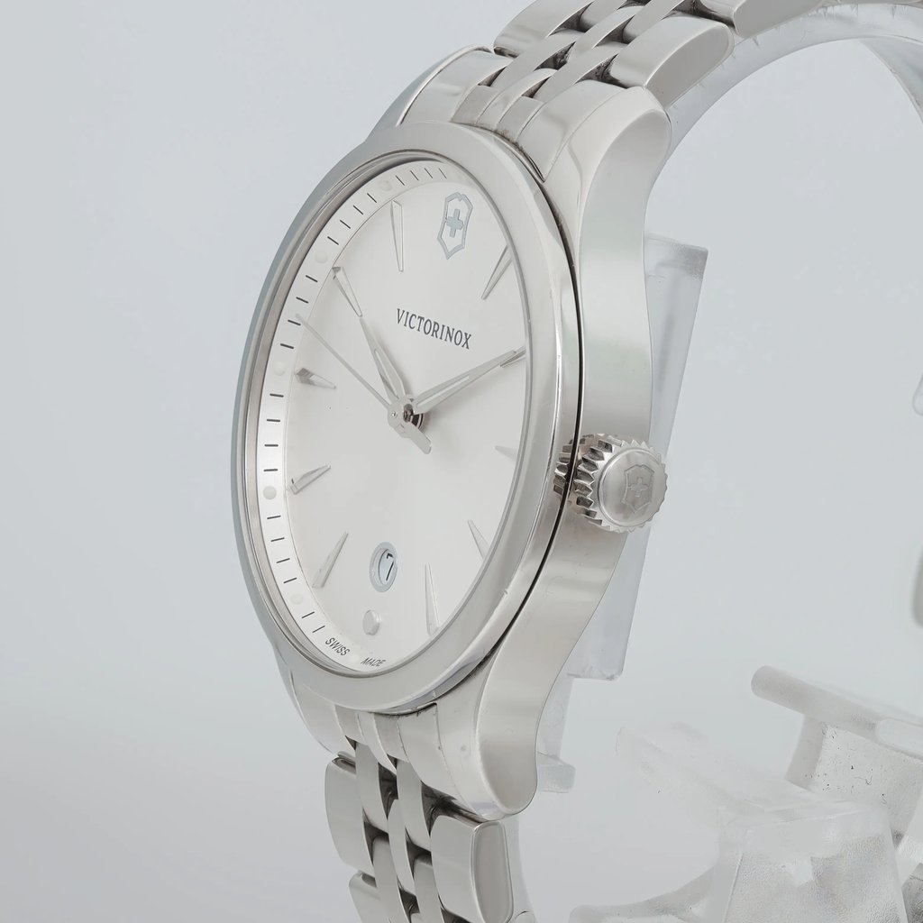 An image of a Wristwatch by Victorinox. This Pre Owned item is designed for Women, featuring a Casual style. It has a Quartz movement and an Analog display with a Silver dial color. The indices include 12-Hour Dial,Arrow Markers. The band is made of Stainless Steel and the case is made of Stainless Steel. The watch has a Round shape with a case size of 35 mm and a case thickness of 8 mm.