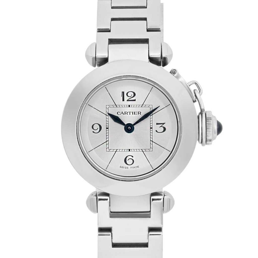 An image of a pre-owned Cartier Miss Pasha women's wristwatch, captured from a front-facing angle. The watch is positioned centrally, showcasing its round silver face with black numerals at the 12, 3, 6, and 9 o'clock positions. The blue hour and minute hands are prominently visible. The silver metal bracelet is partially visible at the top and bottom. The image is taken from a close distance, highlighting the watch's elegant design and detailing.