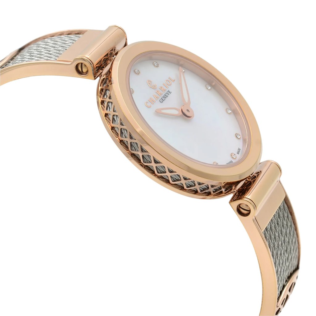 An image of a pre-owned wristwatch viewed from the side profile, opposite the crown. The angle highlights the watch's elegant design, featuring a rose gold-toned case with a textured pattern on the side. The watch face is set at a slight angle, showcasing its minimalist dial with delicate markers and hands. The mesh strap adds a sophisticated touch, visible from this perspective.
