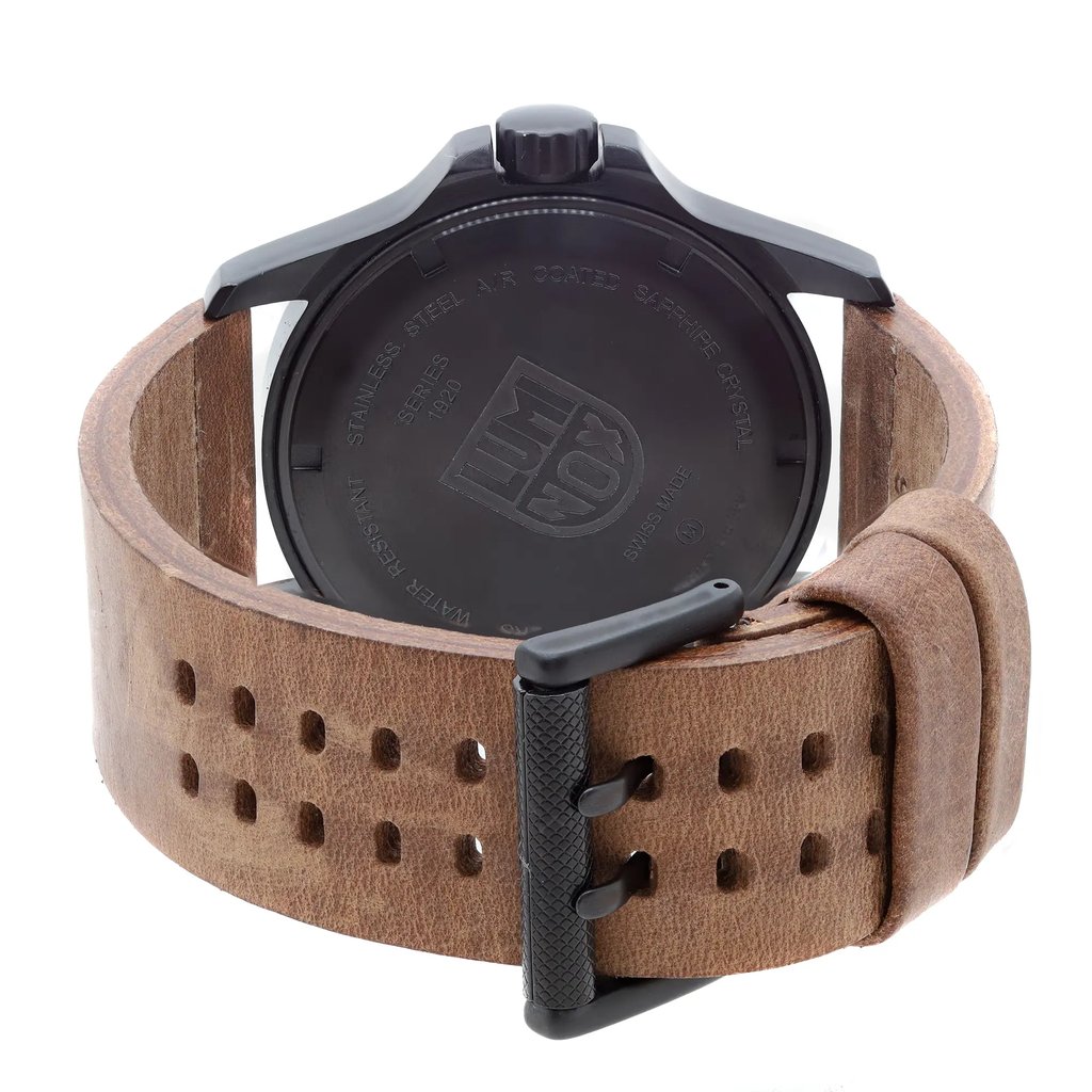 An image of a Wristwatch by Luminox. This Display Model item is designed for Men, featuring a Dress/Formal style. It has a Quartz movement and an Analog display with a Black dial color. The indices include 12-Hour Dial,Arabic Numerals,Easy to Read/Large Numerals. The band is made of Leather and the case is made of Stainles Steel. The watch has a Round shape with a case size of 45 mm and a case thickness of 12 mm.