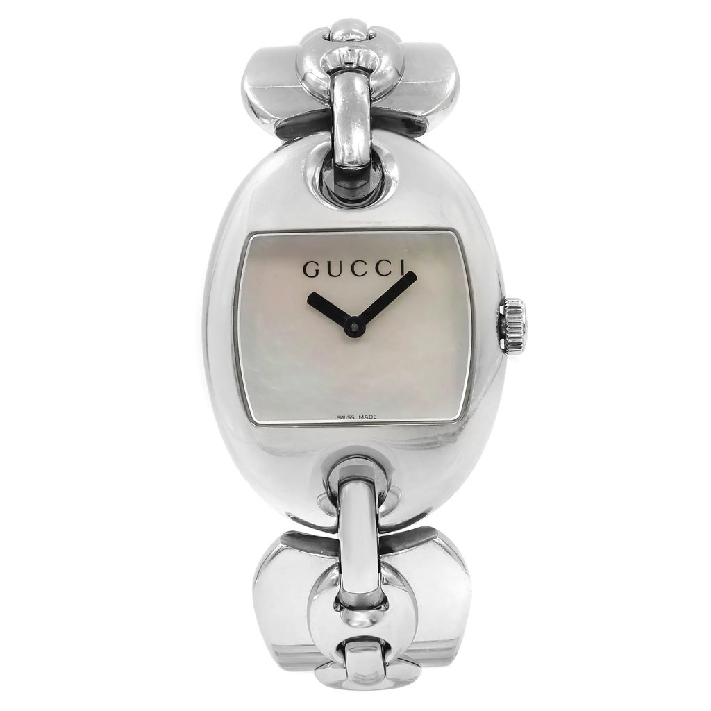 An image of a Wristwatch by Gucci. This Pre Owned item is designed for Women, featuring a Casual style. It has a Quartz movement and an Analog display with a White dial color. The indices include 12-Hour Dial,No Hour Marks. The band is made of Stainless Steel and the case is made of Stainless Steel. The watch has a Tonneau shape with a case size of 32 mm and a case thickness of 10 mm.