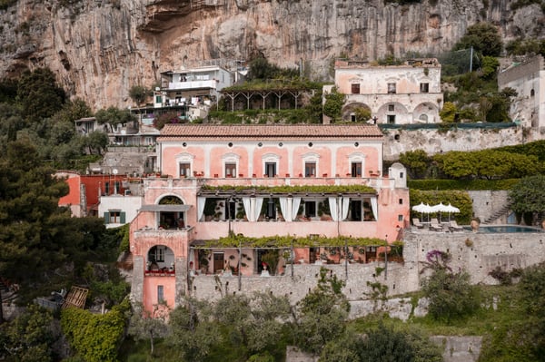 Villa San Giacomo — rose-pink villa terraced into the cliffs of Positano on the Amalfi Coast
