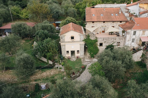Borgo Vaggi — historic 1690 stone village wedding venue in northern Tuscany with olive tree garden and private chapel
