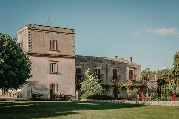 Borgo del Carato — restored Sicilian borgo on 90 hectares of carob and olive groves near Palazzolo Acreide, with Baroque chapel and saltwater pool