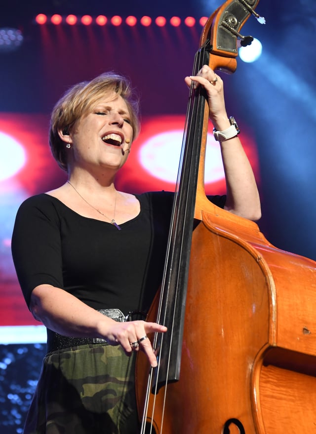 Judith Dutton singing as she plays the upright bass
