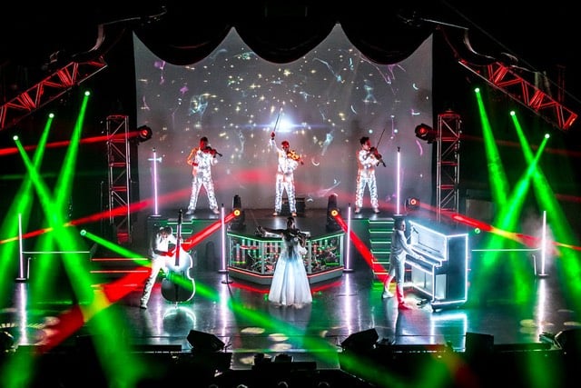 The Haygoods performing under colored stage lights