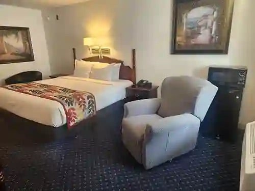 Guest room with a recliner and microwave