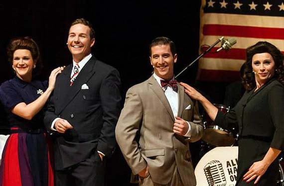 Four All Hands on Deck! performers in 1940s outfits on stage