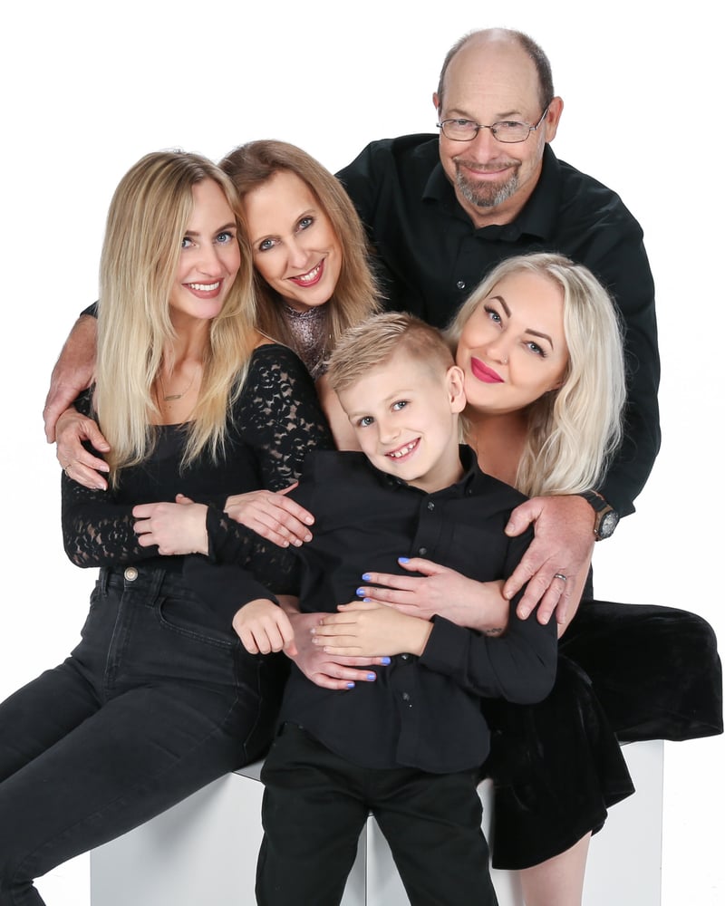 Promotional portrait for Listen to the Music: a family of five dressed in black