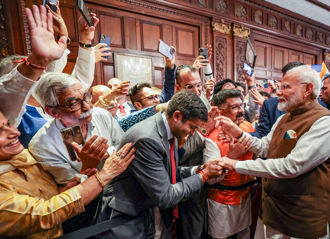 PM Narendra Modi was greeted by hundreds of Indians who had gathered at the airport in Philadelphia. (PTI Photo)