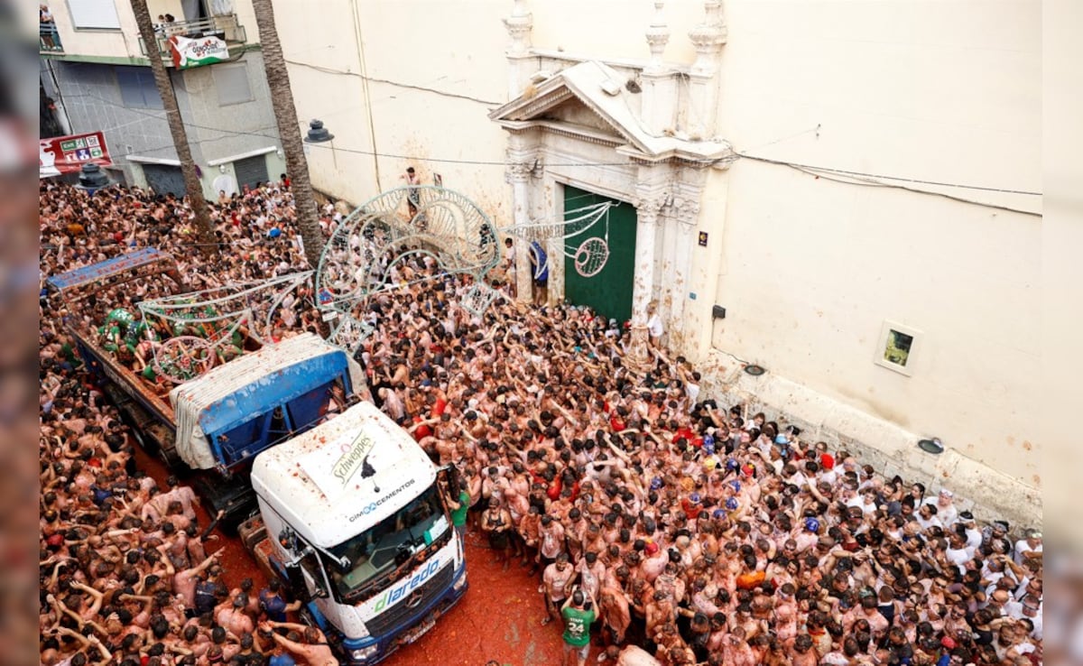 Participants attend the annual food fight festival La Tomatina in Bunol, near Valencia, Spain