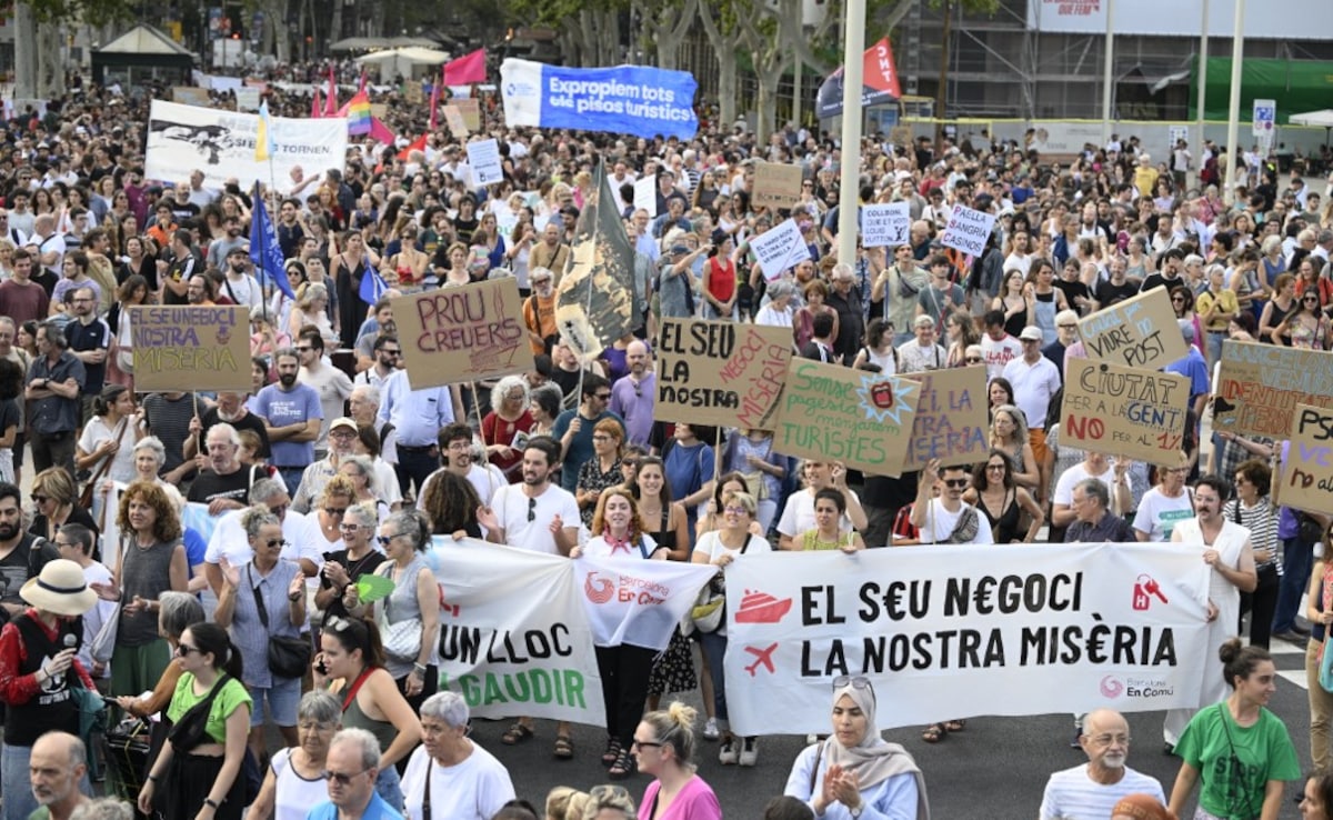 Demonstrators march during a protest against mass tourism in Barcelona