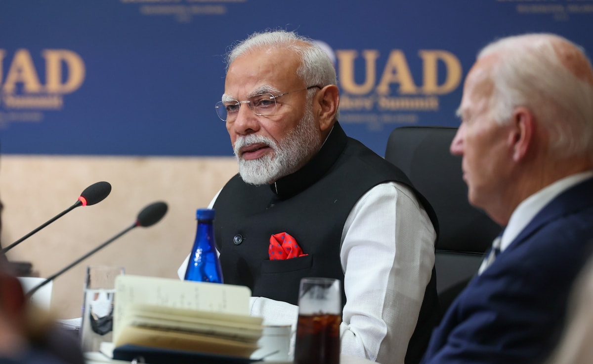 Prime Minister Narendra Modi speaks as US President Joe Biden looks on at the Quad Leaders Summit