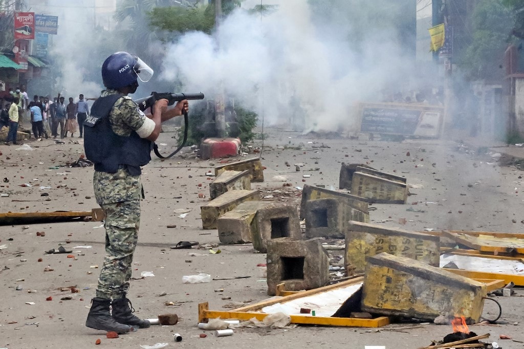 Bangladesh Police uses tear gas against protesters.
