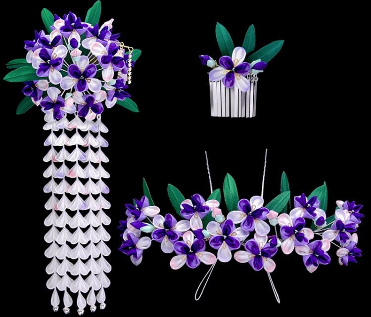 Un assortiment de hana-kanzashi pour le mois de mai avec des iris violets et des glycines