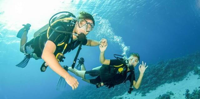 Red Dunes Desert Safari Quad Biking Camel Riding Sand Boarding Live BBQ