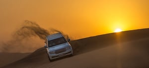 Sunrise Desert Safari with 30 Minutes Camel Riding & Sand Boarding