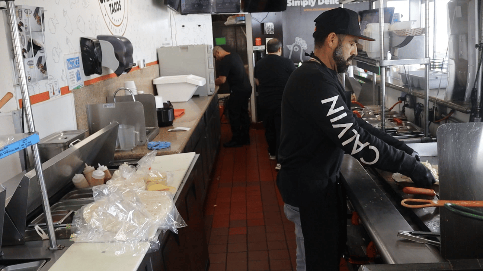 Lisandro Madrigal working the line at a Chando's Tacos kitchen in Sacramento