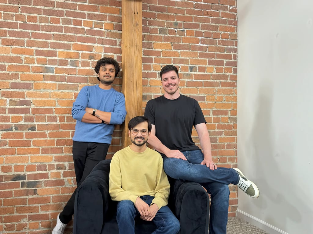 VoiceBit's three founders in front of a brick wall