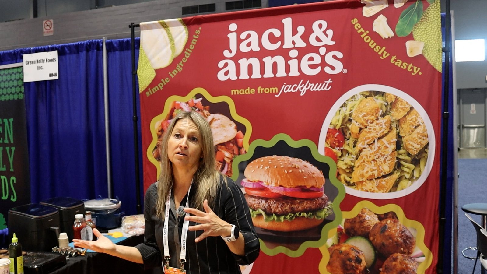 Beata Pabian speaking in front of the Jack & Annie's booth at the National Restaurant Association Show