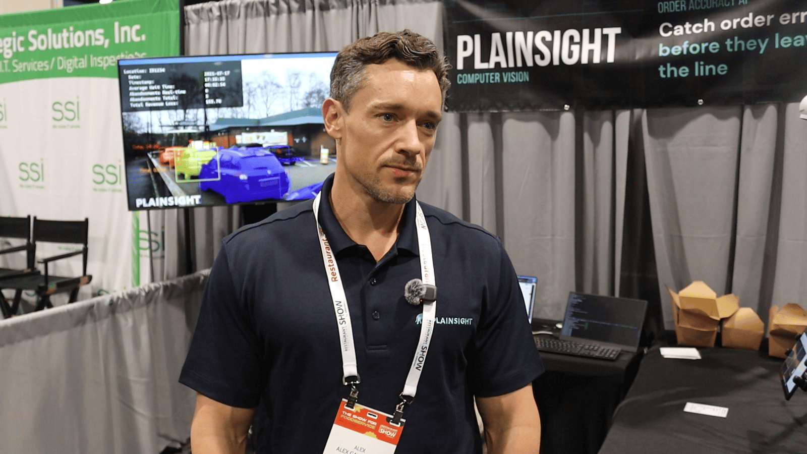Alexander Gallagher from Plainsight speaking at the Plainsight booth during the National Restaurant Association Show
