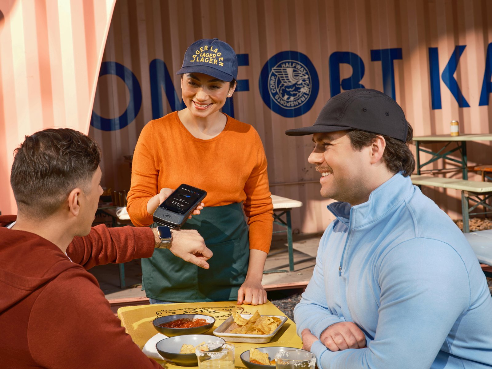 Smartphone screen showing a restaurant mobile ordering app with food items and a shopping cart