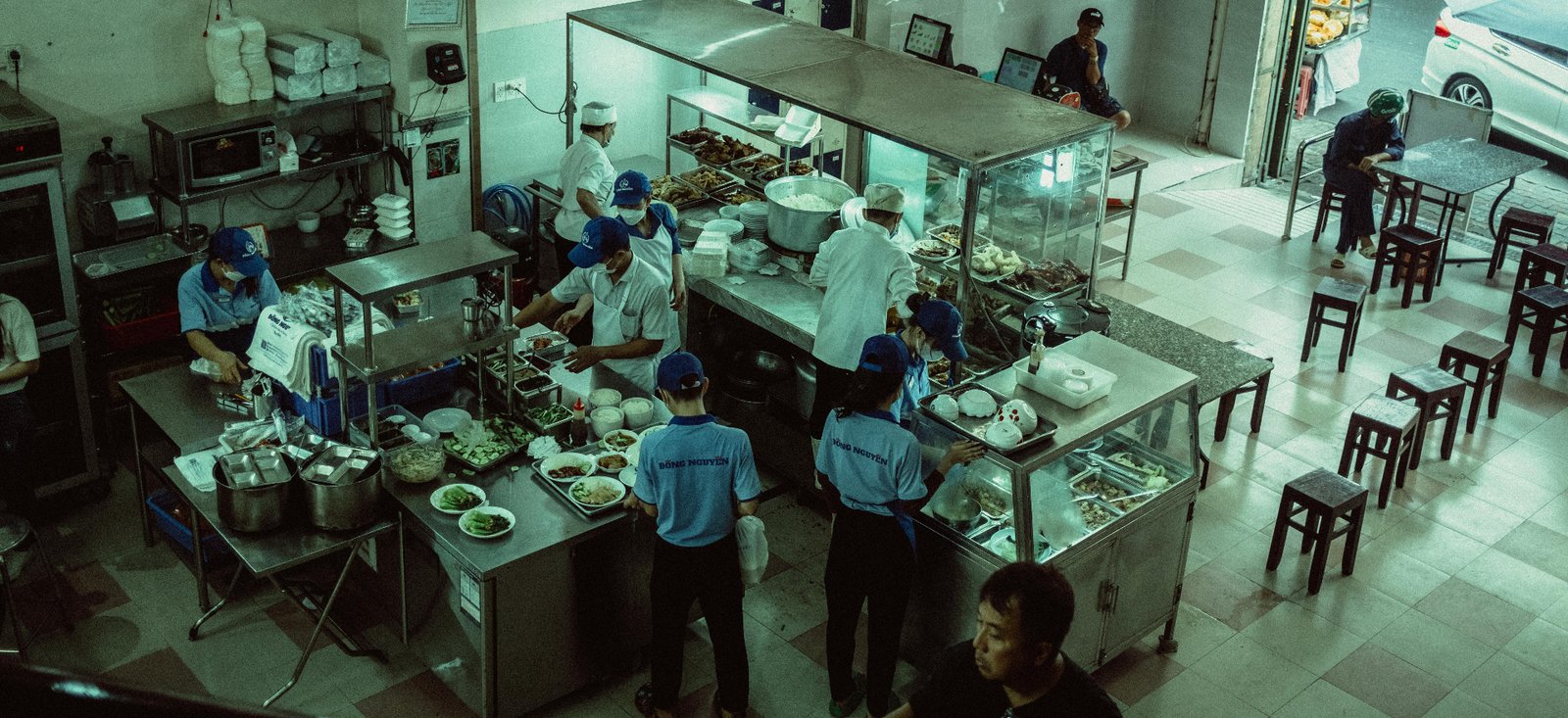 Overhead view of a busy restaurant kitchen during service