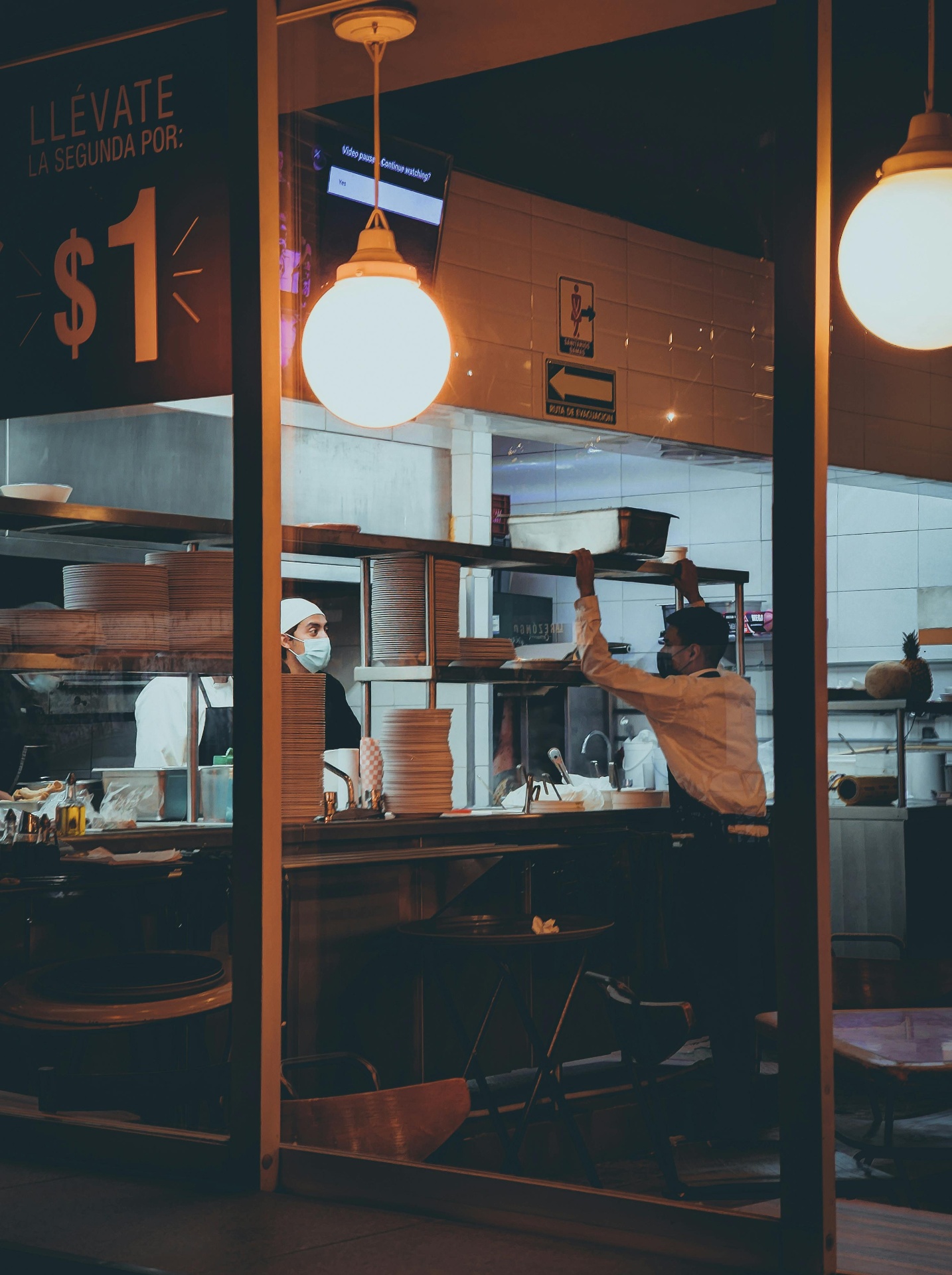 Restaurant staff using a POS terminal to centralize order flow