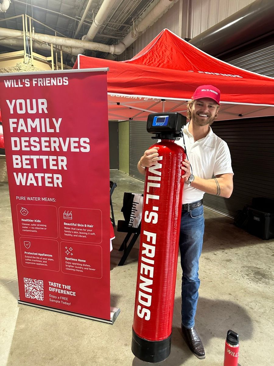 Will with a Will's Friends water system at the Williamson County Fair