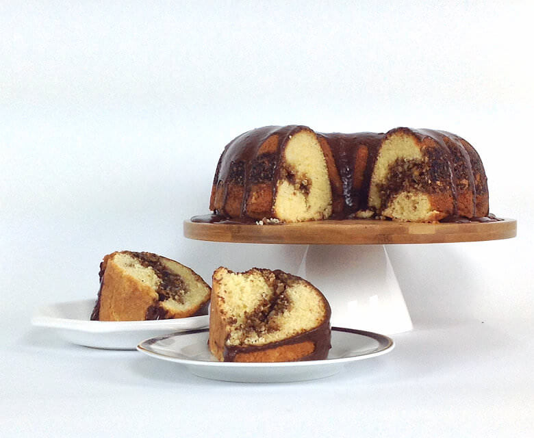 Picture of Coffee Cake with Nuts and Chocolate Glaze, cut and wedges on plates