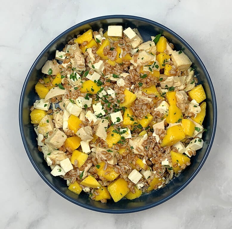 Picture of a plate with Farro Salad with Mango Chicken and Feta