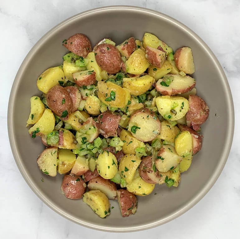 Bowl with French potato salad