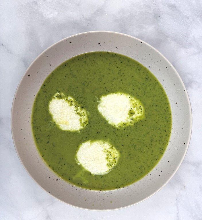 Bowl with Green Pea Soup with three Cheese Quenelles 