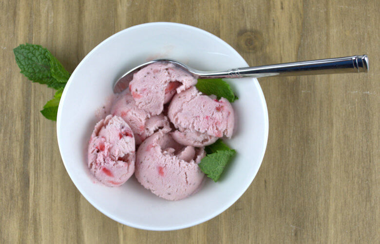 No-Churn Strawberry Ice Cream curls in white bowl