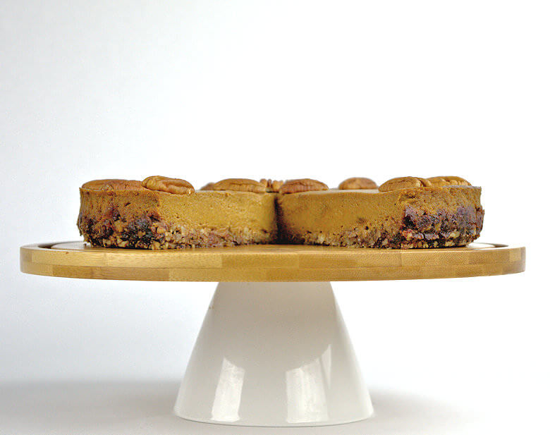 Picture of pumpkin pie straight on, wedge cut out