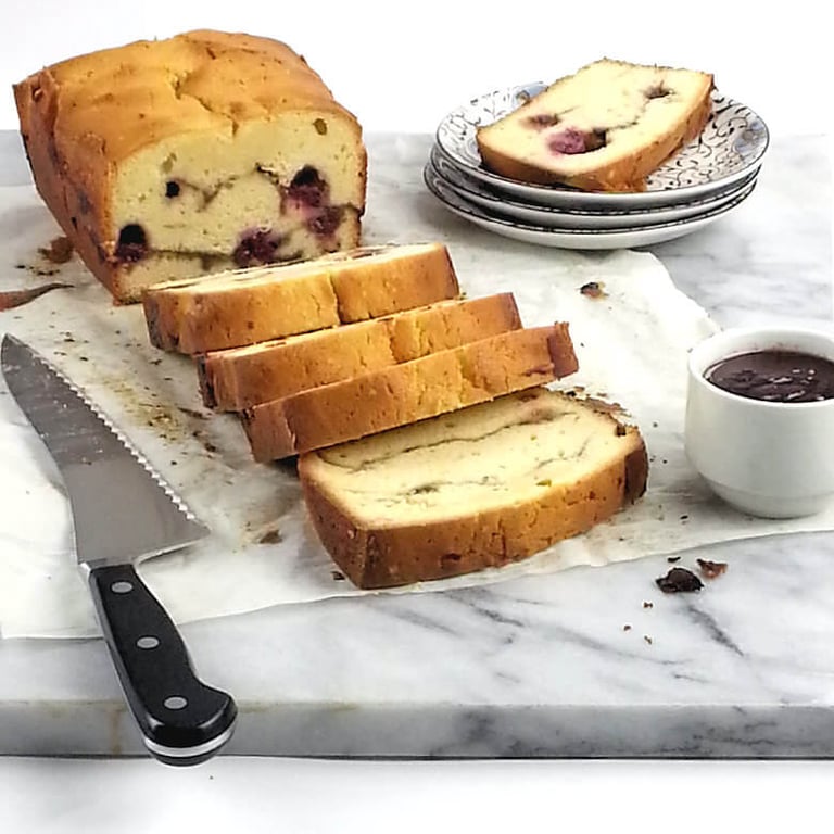 Loaf of raspberry swirl cream cheese cake in slices.