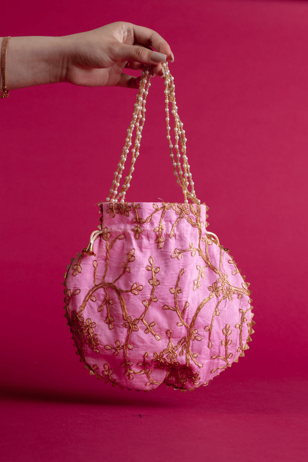 Thread work embroidered potli bag