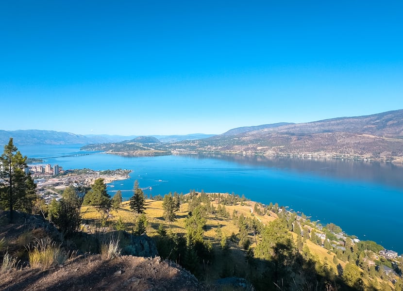 View of Kelowna and Okanagan Lake on a sunny day from Knx Mountain.