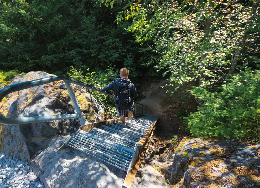 Descending metal stairs along a rocky section of the Lava Canyon Trail’s second part near Mount St. Helens