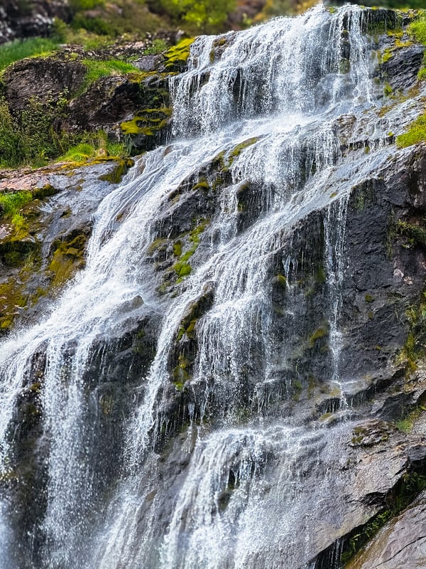 Close up of the water as it falls over the rock.