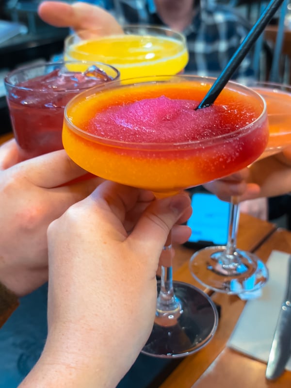 Peach Bellini drink, toasting drinks at the White Spot in YLW