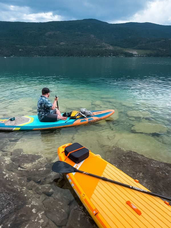 Man on a paddleboard with stormy skies