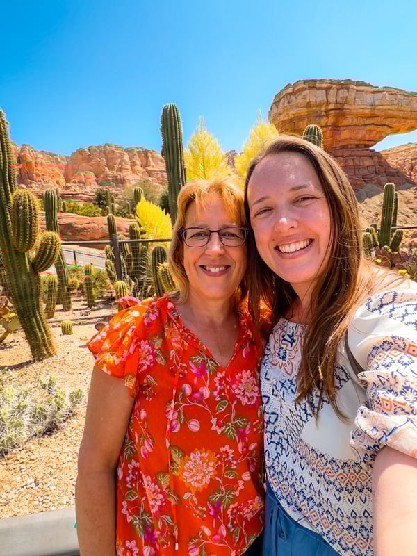 Selfie of two women in front of the cacti in front of Radiator Springs Racers in California Adventure