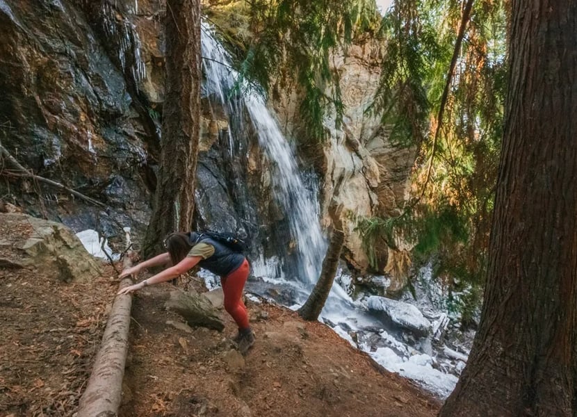 Woman struggles to the Cosens Bay waterfall viewpoint