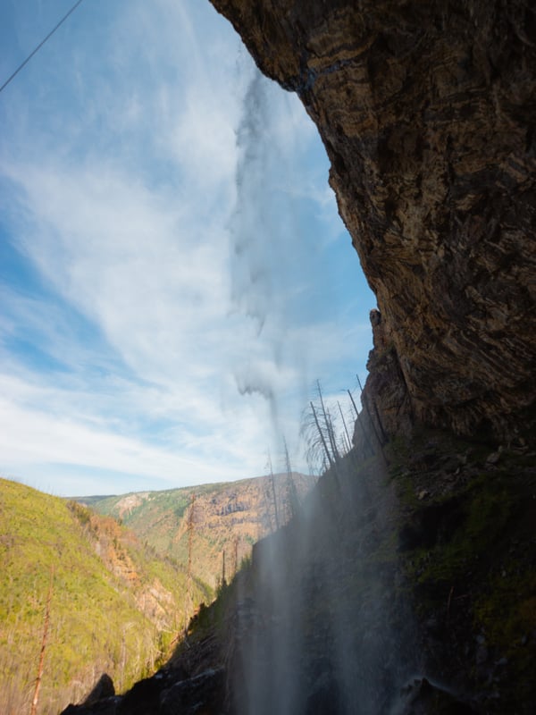 View of Christie Falls from behind the waterfall.