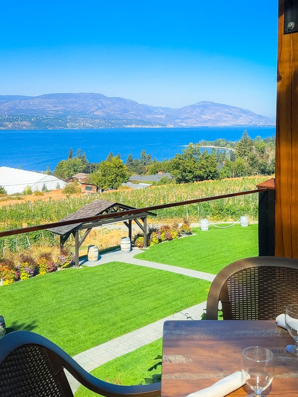 View from Summerhill Winery's dining patio overlooking Okanagan Lake on a sunny summer day in Kelowna.